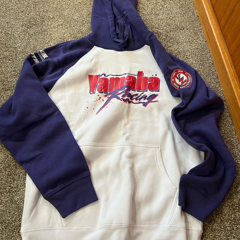 Size large, white with purple sleeves.